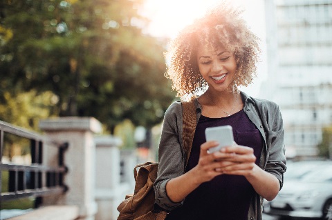 Woman using smartphone outside