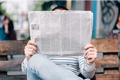 Person Holding Newspaper